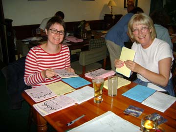 Lisa Needham and Rita Martin assembling the fete programmes