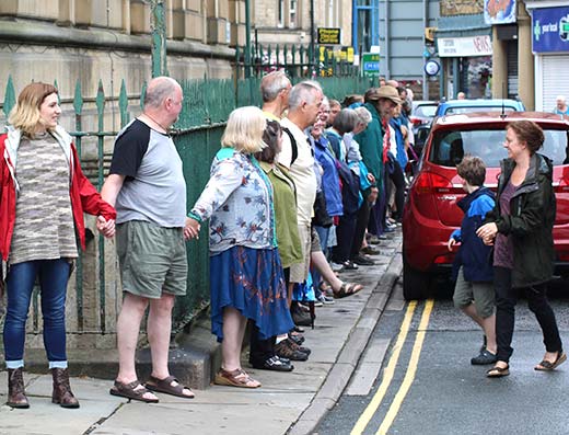 Hands around Todmorden Town Hall